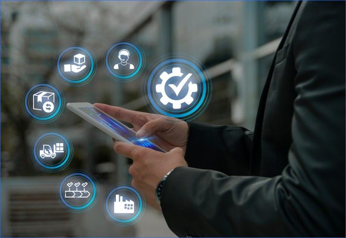 Person using a smartphone with icons showing inventory, logistics, support, and process automation.