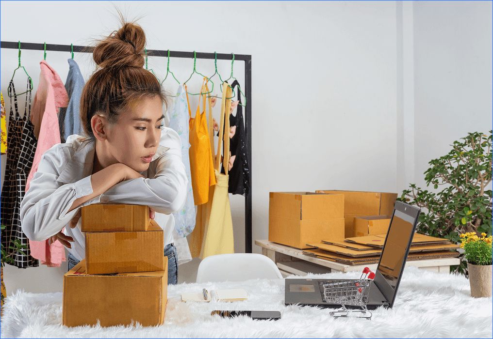 Small business owner managing online orders and digital commerce alongside retail operations