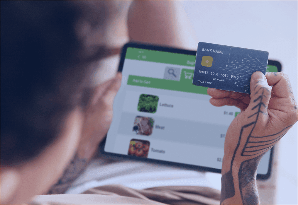 Customer using digital retail banking with a credit card on a tablet for online payments